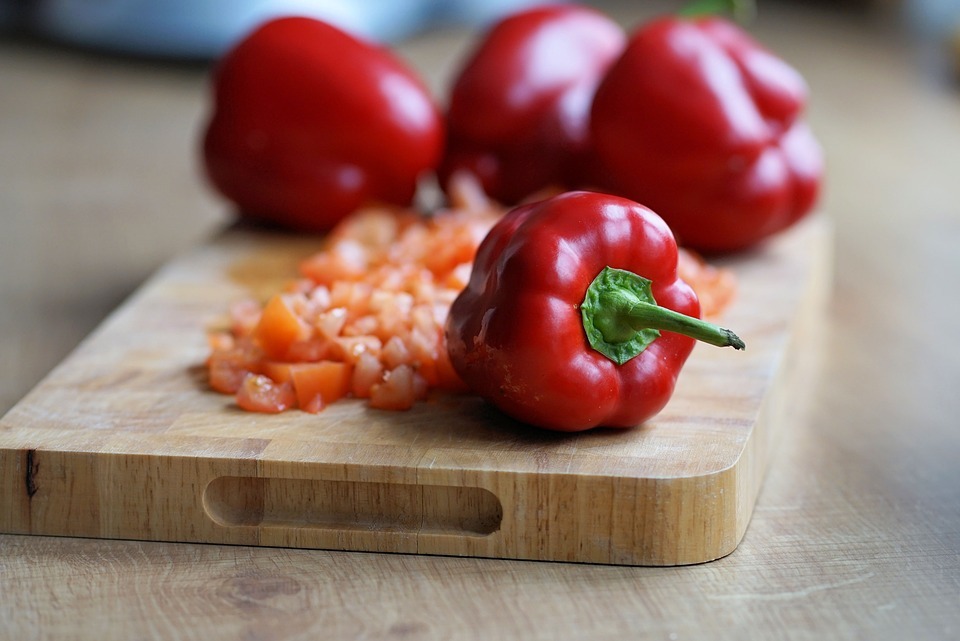 Red peppers on a chopping board